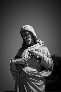 Low angle view of statue against sky