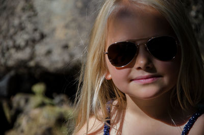 Close-up portrait of woman with sunglasses