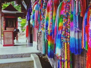 Multi colored flags hanging at market stall