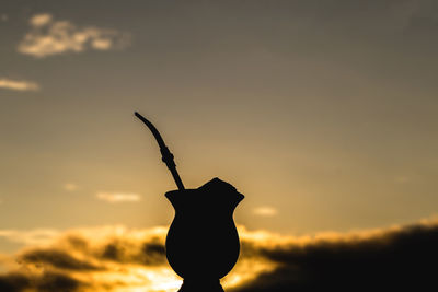 Close-up of silhouette plant against sky during sunset