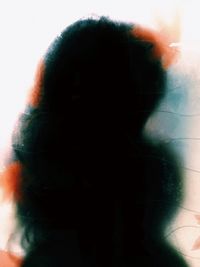 Portrait of man standing against white background