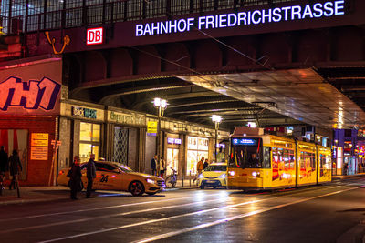 Cars on street in city at night