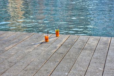 High angle view of bottle on water at swimming pool