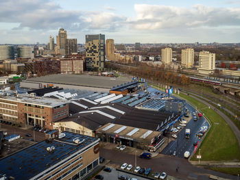 High angle view of buildings in city against sky