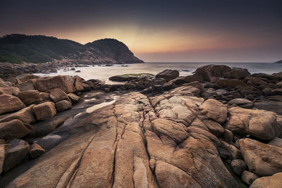 Scenic view of sea against sky at sunset