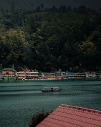 Scenic view of lake against trees