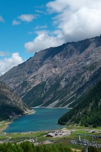 Scenic view of landscape and mountains against sky