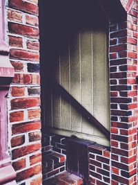 Brick wall with buildings in background