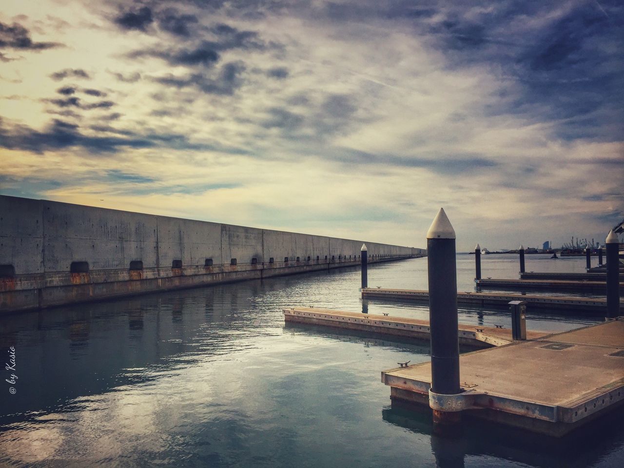 water, built structure, architecture, sky, cloud - sky, pier, waterfront, building exterior, cloudy, cloud, river, connection, bridge - man made structure, reflection, sea, railing, rippled, jetty, bridge, outdoors