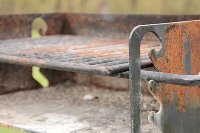 Close-up of old metal bench