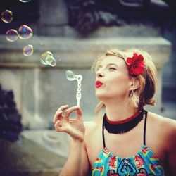 Portrait of young woman in bubbles