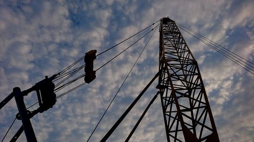 Low angle view of silhouette bridge against sky