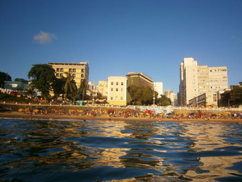 View of cityscape against blue sky