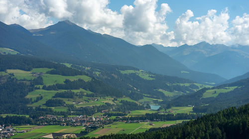 Scenic view of landscape and mountains against sky