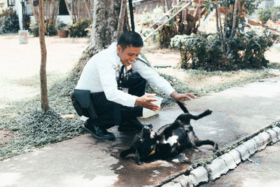 Full length of a man with dog