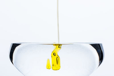 Close-up of clothes hanging on white background