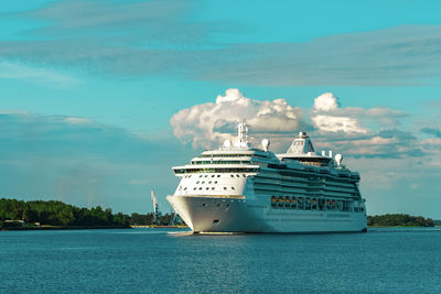 Ship sailing in sea against sky