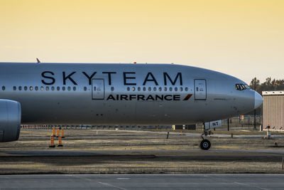 Information sign on airport runway against clear sky