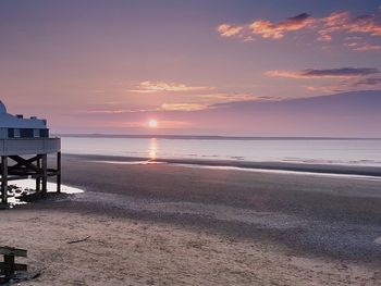 View of beach at sunset