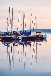 Yachts and boats moored in a harbour at sunrise. candid people, real moments, authentic situations