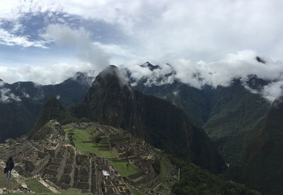 Scenic view of mountains against cloudy sky