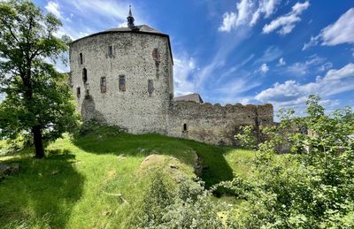 Low angle view of old ruins against sky