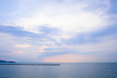View of calm sea against cloudy sky