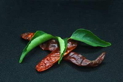 High angle view of chili peppers on table