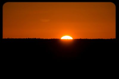 Scenic view of sunset over landscape