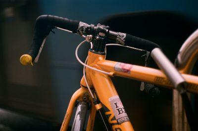 Close-up of bicycle hanging on metal