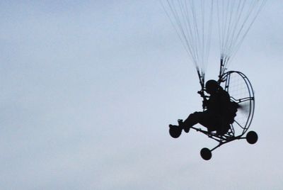 Low angle view of man against clear sky