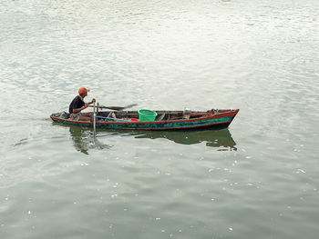 High angle view of man on boat in river