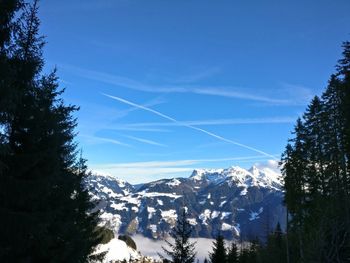 Scenic view of winter landscape against blue sky