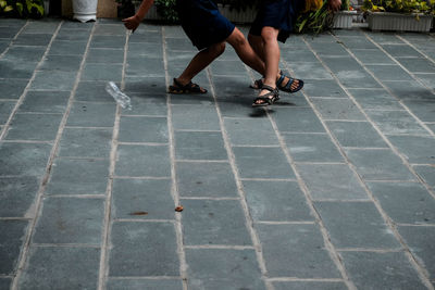 Low section of people walking on footpath