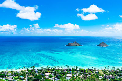 Scenic view of sea against blue sky