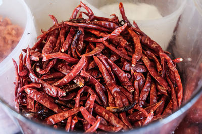 High angle view of red chili peppers in container