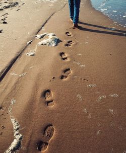 Low section of person on sand