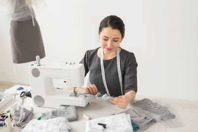 Mid adult woman working in office