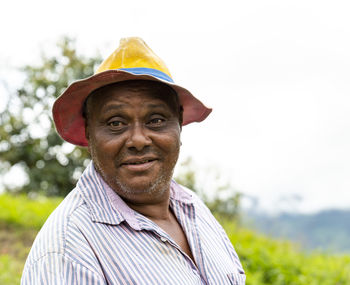 Portrait of man wearing hat standing outdoors