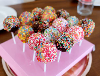 High angle view of multi colored lollipops on table