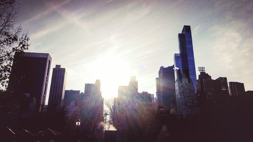 Skyscrapers in city against sky