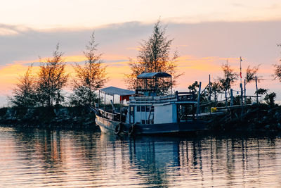 Scenic view of lake against sky during sunset