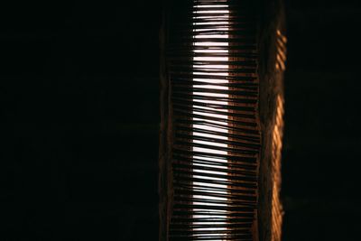Close-up of electric lamp against black background