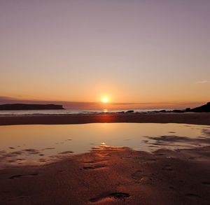 Scenic view of beach during sunset