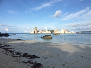 Scenic view beauty of nature of belitung beach against sky with rock formation