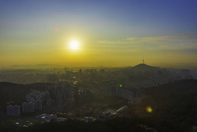 High angle view of city during sunset