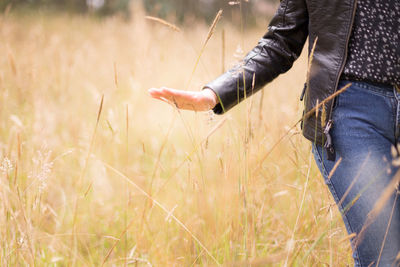 Close-up of woman standing on field