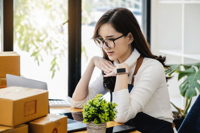 Young woman using mobile phone