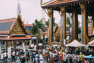 Group of people in temple outside building