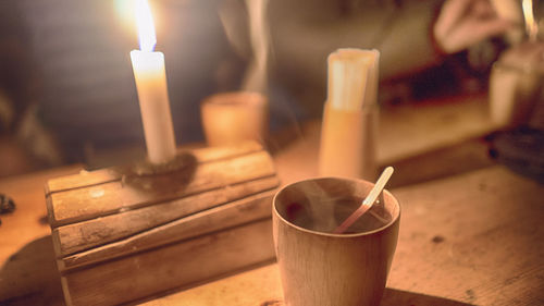 Close-up of candles on table